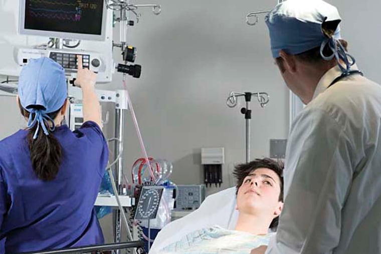 Surgeons with patient