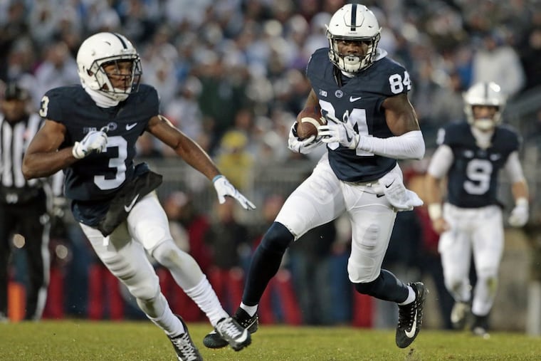 Juwan Johnson (84) takes off after a catch against Nebraska during the first half