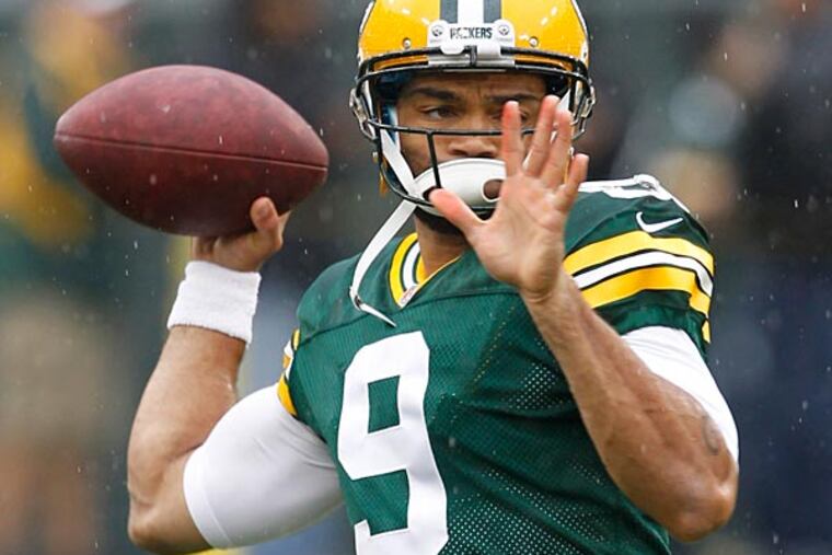 Green Bay Packers' Seneca Wallace warms up before an NFL football game against the Washington Redskins Sunday, Sept. 15, 2013, in Green Bay, Wis. (AP Photo/Mike Roemer)