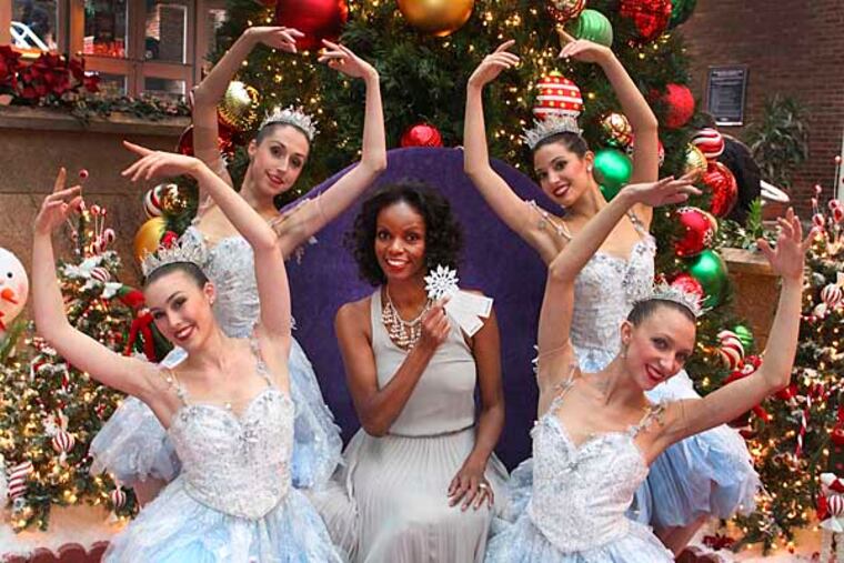 Pennsylvania Ballet's Nutcracker snowflake dancers for a photo for Jenice's annual Oprah-style My Favorite Things Holiday Gift Giveaway, Tuesday, November 20, 2012. Front row (l-r) Elizabeth Mateer, Holly Lynn Fusco, Jenice, center, top (l-r) Evelyn Kocak. ( STEVEN M. FALK/ Staff Photographer )