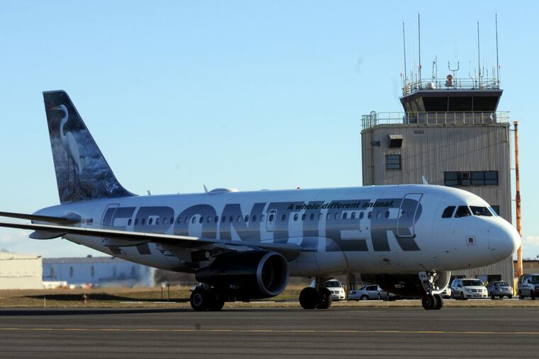 A Frontier Airlines jet taxis at Trenton-Mercer County Airport.