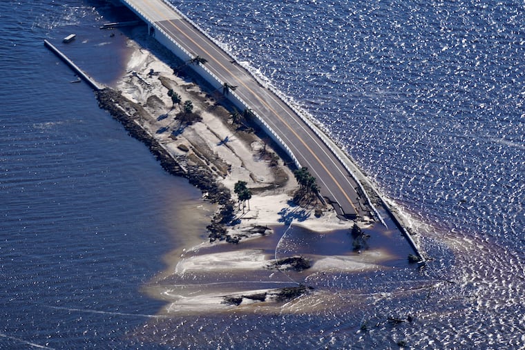 In this aerial photo made in a flight provided by mediccorps.org, damage from Hurricane Ian is seen on the causeway leading to Sanibel Island from Fort Myers, Fla., Friday, Sept. 30, 2022.