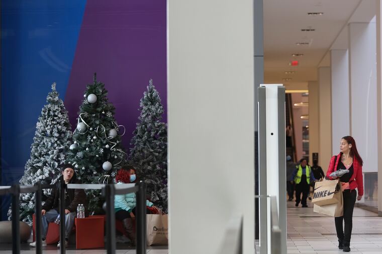 Shoppers can be seen inside the Fashion District by 9th and Filbert St. in Philadelphia on Black Friday, Nov. 24, 2023.