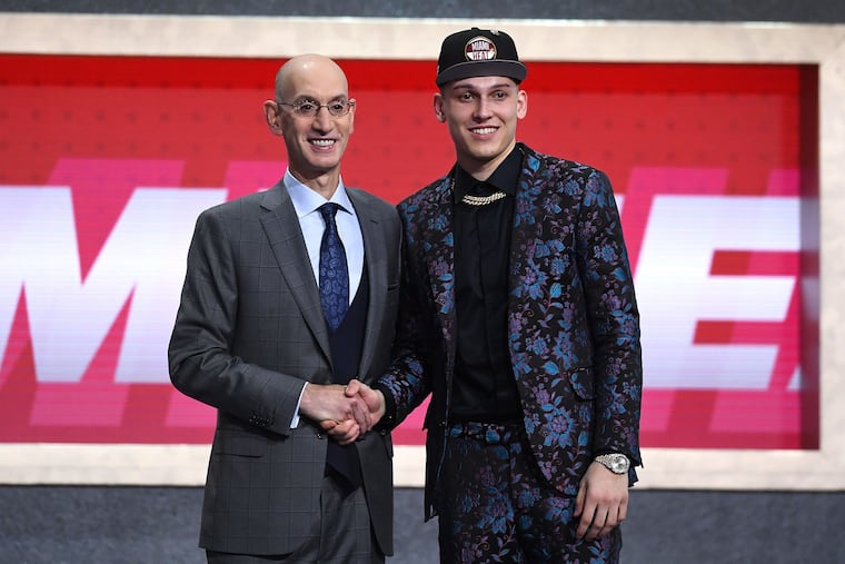 Tyler Herro, right, posed with NBA commissioner Adam Silver after being drafted with the 13th overall pick by the Miami Heat during the 2019 NBA draft at the Barclays Center in Brooklyn. The NCAA and draft evaluation could be altered with the NBA G League development program.