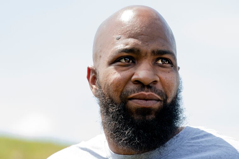 John Miller of Philadelphia, looks on outside the SCI Mahanoy State Correctional Institution in Frackville, Pa. Wednesday, July 31, 2019. Miller was imprisoned for 22 years for murder before his conviction was vacated.