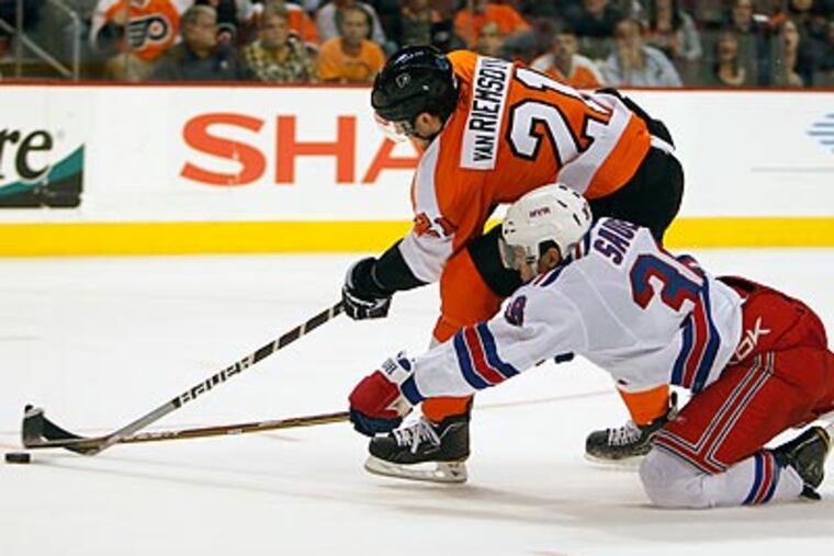 James van Riemsdyk can't move past Rangers defensemen Michael Sauer in the second period. (Ron Cortes/Staff Photographer)