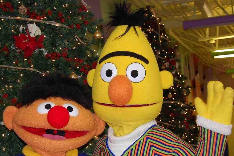 Bert and Ernie by a Christmas Tree during last year's holiday party at Sesame Place.