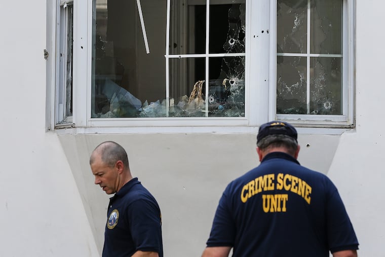 The Philadelphia Police Crime Scene Unit investigate in the 3700 block of N. 15th where six Philadelphia police officers were shot last Aug. 14.