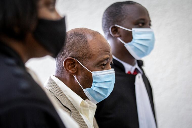 Paul Rusesabagina (center) at the Kicukiro Primary Court in Kigali, Rwanda, in September 2020.