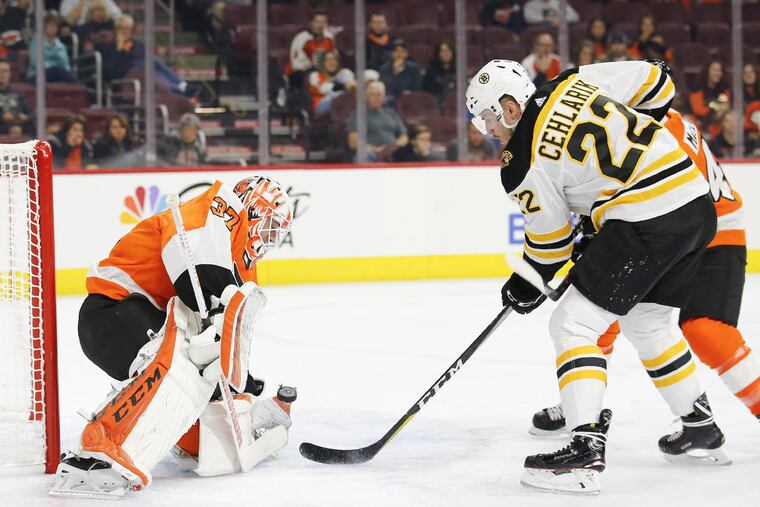 Boston Bruins left winger Peter Cehlarik scores against Flyers goaltender Brian Elliott Monday's preseason game. Elliott is trying to bounce back from core-muscle and hip surgeries.