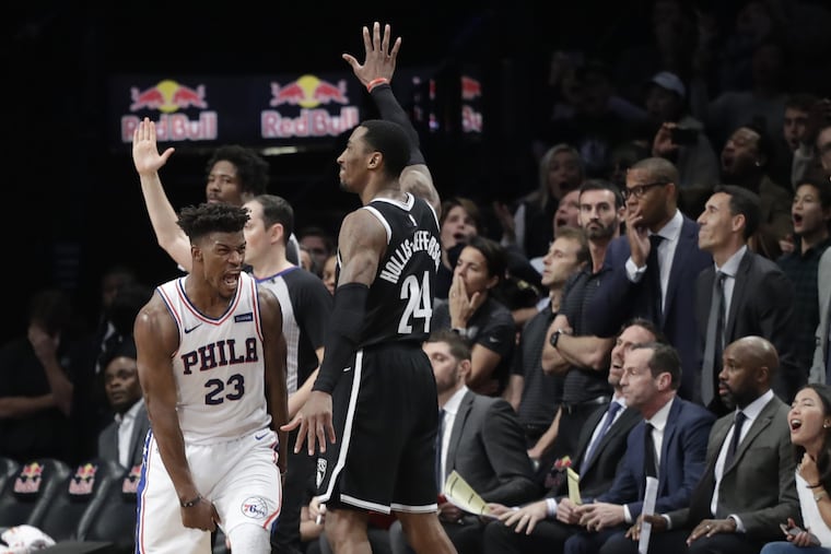 Jimmy Butler (23) reacts after sinking his game-winning three-point shot against the Nets.