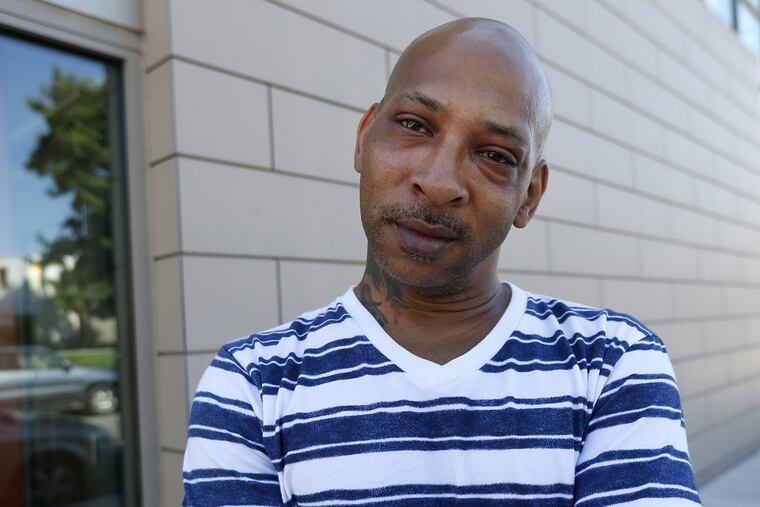 Kirk Crawford in front of 2144 Cecil B. Moore Ave., once the site of his barbershop and now home to the Stephen Klein Wellness Center.