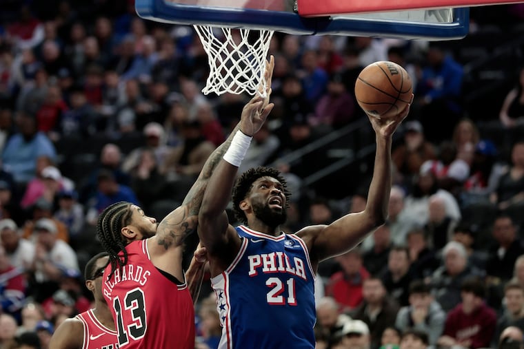 Joel Embiid (right) scored 35 points in his return from a 13-game absence.