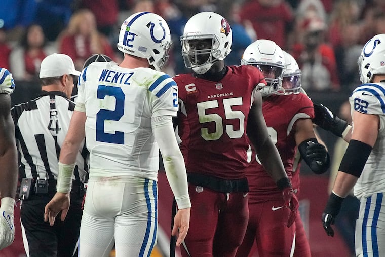 Arizona Cardinals outside linebacker Chandler Jones (55) greets Indianapolis Colts quarterback Carson Wentz (2) after an NFL football game, Saturday, Dec. 25, 2021, in Glendale, Arizona.