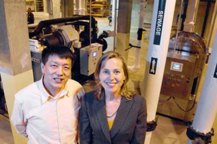 Jimmy W. Wang, chief engineer, and Elinor Haider, chief executive, at NovaThermal Energy, which has licensed technology called sewage geothermal to extract warmth from wastewater to heat and cool buildings. CLEM MURRAY / Staff Photographer