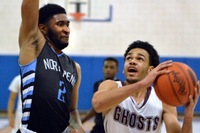 Abington’s Robbie Heath, right, drives for a basket in a game last season against North Penn.