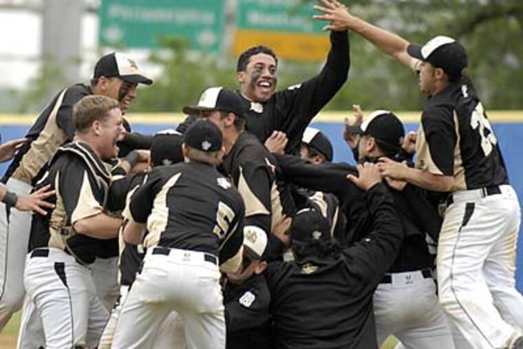 Neumann-Goretti players celebrate on the mound. “This is an amazing bunch of kids,” said Saints manager Lou Spadaccini. (Ron Tarver/Staff Photographer)