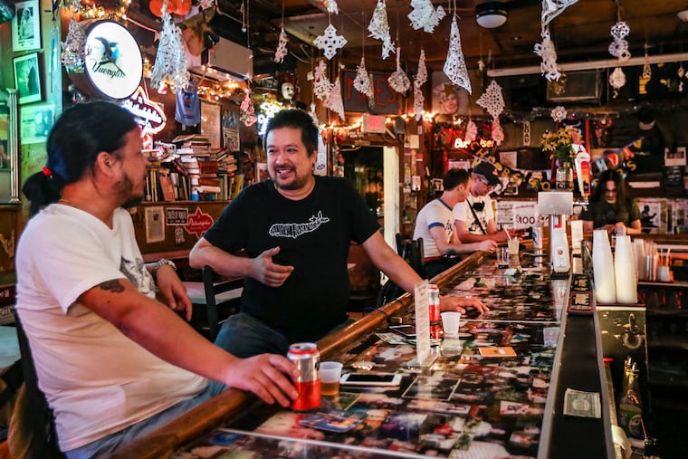 Sid Lee, left and Get Ling enjoy drinks at Dirty Franks, 347 S 13th Street.Tuesday, August 31, 2021