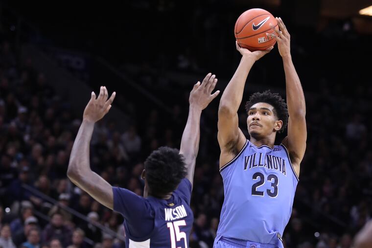 Villanova's Jermaine Samuels shooting over Sidney Wilson of Connecticut during the second half Saturday.