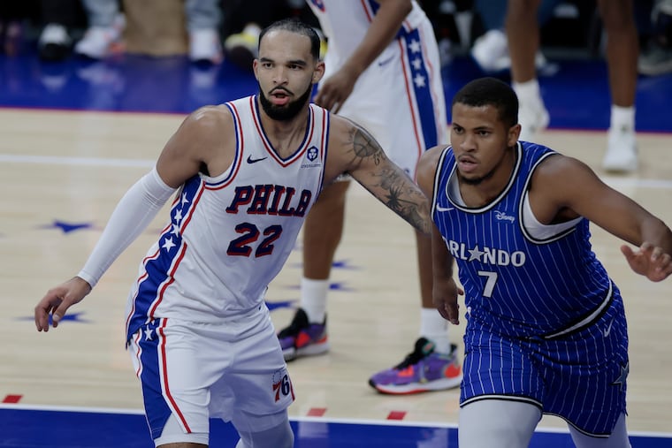 Johni Broome (left) guarding Orlando’s Orlando Robinson. The Sixers rookie has appeared in only two regular-season games.