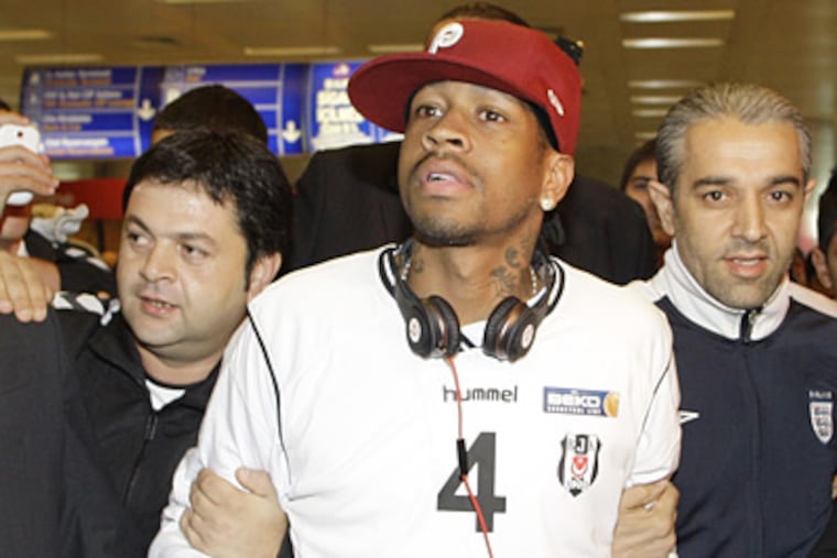 Allen Iverson is surrounded by cheering supporters of Besiktas at the Ataturk airport in Istanbul, Turkey. (AP Photo/Ibrahim Usta)