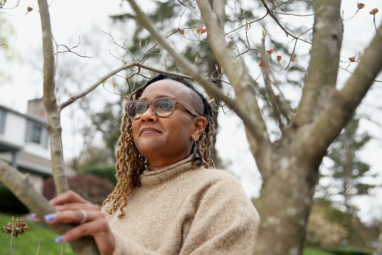 Karen Campbell stands for a portrait outside her Glenside, Pa., home on Friday, April 9, 2021. She was deemed cancer-free at the start of the coronavirus pandemic and has experienced a roller coaster of emotions during the process of getting her COVID-19 vaccine.