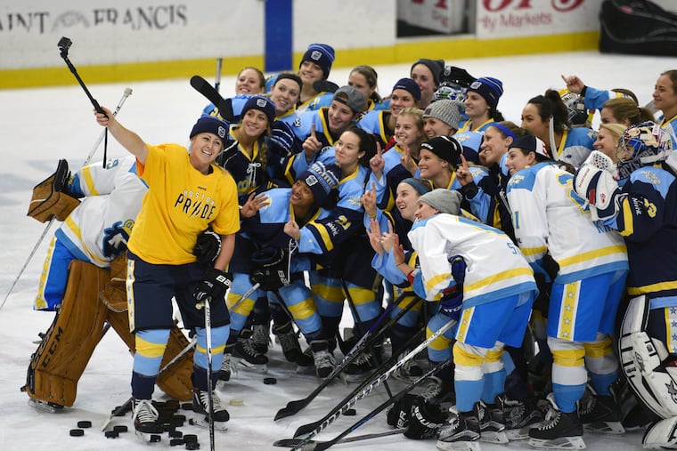 In this Jan. 24, 2016, photo, National Women's Hockey League All-Star players took time for a photo before an All-Star game in Buffalo, N.Y.
