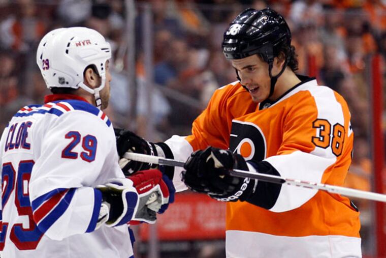 Oliver Lauridsen shoves New York Rangers' Ryane Clowe on Tuesday, April 16, 2013. (Yong Kim/Staff Photographer)