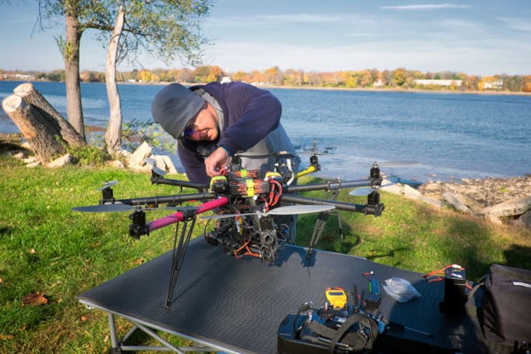 Steve Hindi, president of SHARK, prepares his remote drone copter for launch. ( ED HILLE / Staff Photographer )