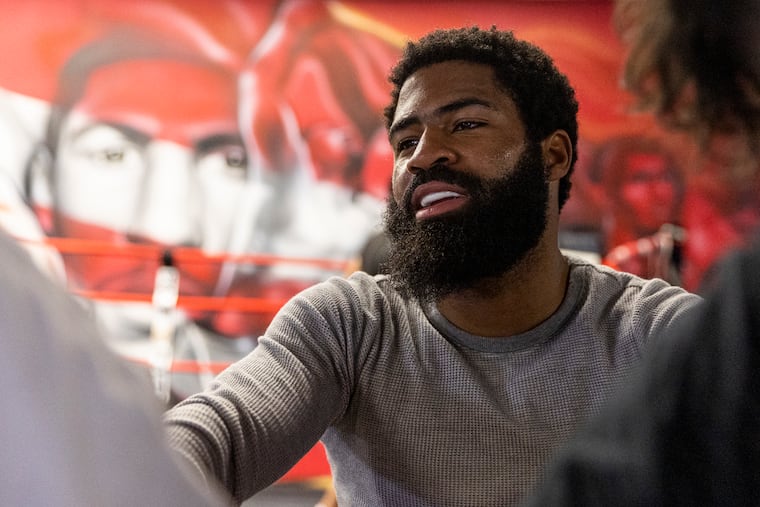 Philadelphia boxer Stephen Fulton has his gloves put on as he gets ready to spar at the DSG gym in on Monday, June 19, 2023.