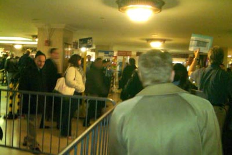 Passengers waited in long lines to board Regional Rail trains at Suburban Station, but many lines moved quickly. A strike by SEPTA workers looks headed into the weekend.