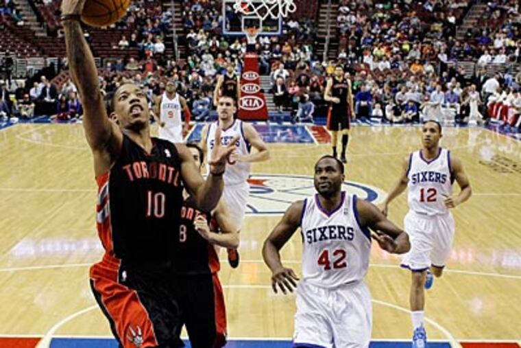 Raptors guard DeMar DeRozan goes up for a layup against the Sixers in the first half on Wednesday. (Alex Brandon/AP)