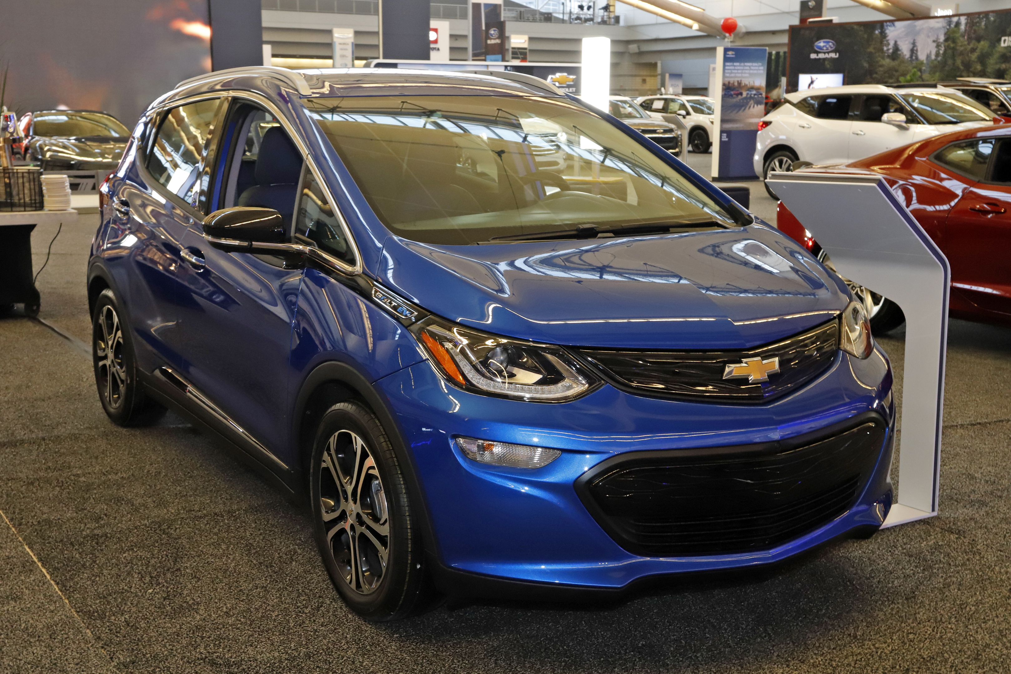 A 2020 Chevrolet Bolt EV is displayed at the 2020 Pittsburgh International Auto Show in Pittsburgh. GM is expected to spend $27 billion on electric vehicles and associated products between 2020 and 2025.