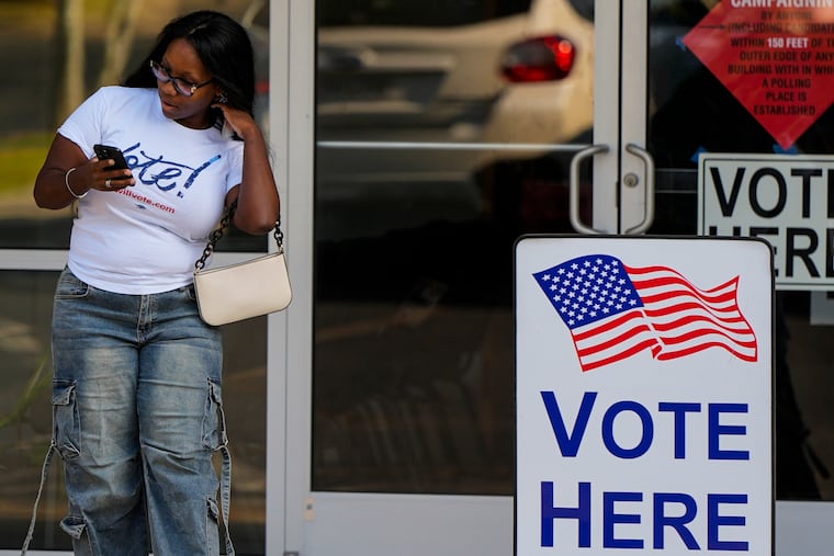 A woman leaves a voting center after voting, Tuesday, May 19, 2026, in Marietta, Ga. Georgia's Legislature will draw new maps for state Senate and House seats.