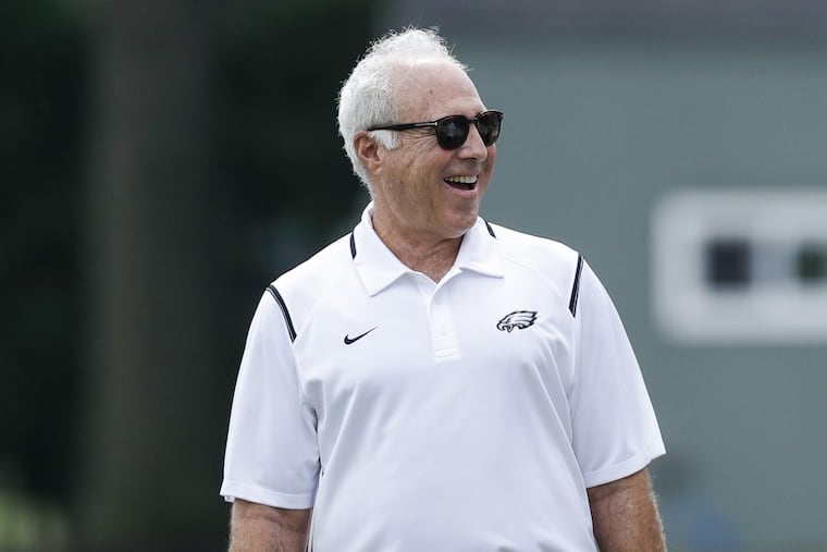 Eagles Chairman and Chief Executive Officer Jeffrey Lurie smiles while watching team practice at the NovaCare Complex of Thursday,