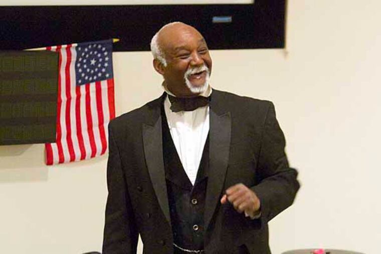 Aubrey Whelan writes about Joe Becton, a retired ranger at the Independence Mall Historical Park who has been telling stories to tourists for more than 10 years relating to black history and the underground railroad. Becton, dressed in period dress entertained a small group of tourists on Saturday at the visitor center. Here, Joe Becton talks about the underground railroad. ( ED HILLE / Staff Photographer )