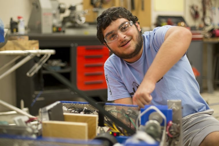 South Jersey Robotics student, Frank DiAntonio, 15, from the LuNaTeCs team, does a demonstration of the team's robot, named Sam, which can throw balls and climb a rope among other things.