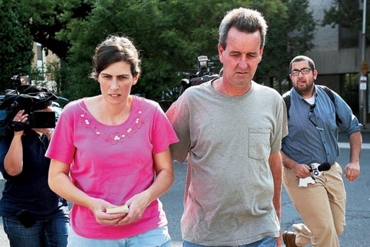 Catherine and Herbert Schaible were charged with third-degree murder, involuntary manslaughter and other charges in the death of another son, Brandon, in April. They are seen here turning themselves in at Philadelphia police headquarters in Philadelphia on May 22, 2013. ( DAVID MAIALETTI / Staff Photographer )