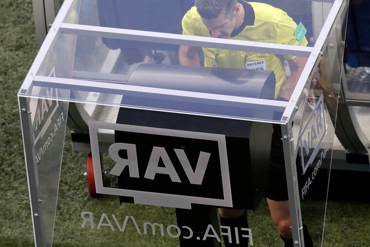 Referee Matt Conger from New Zealand watches the Video Assistant Referee system, known as VAR, during the group D match between Nigeria and Iceland at the 2018 soccer World Cup in the Volgograd Arena in Volgograd, Russia. Women’s World Cup referees are undergoing training with VARs over the next two weeks, The Associated Press has learned, paving the way for the FIFA Council to approve the use of video reviews at this year’s tournament in France.