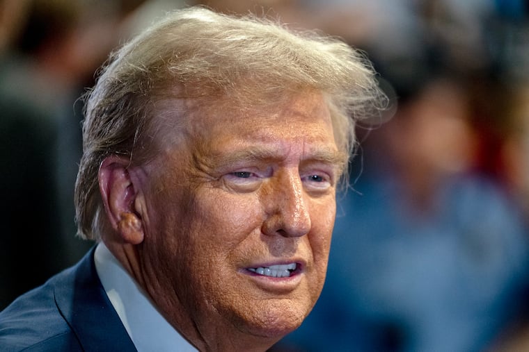 Former President Donald Trump talks with the media following his debate with Vice President Kamala Harris in September.