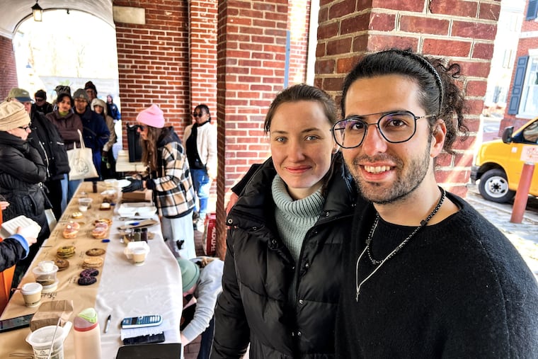 Saif Manna and his wife, Stefaniya Surikova, at their Manna Bakery table at Headhouse Farmers Market on March 1, 2026.