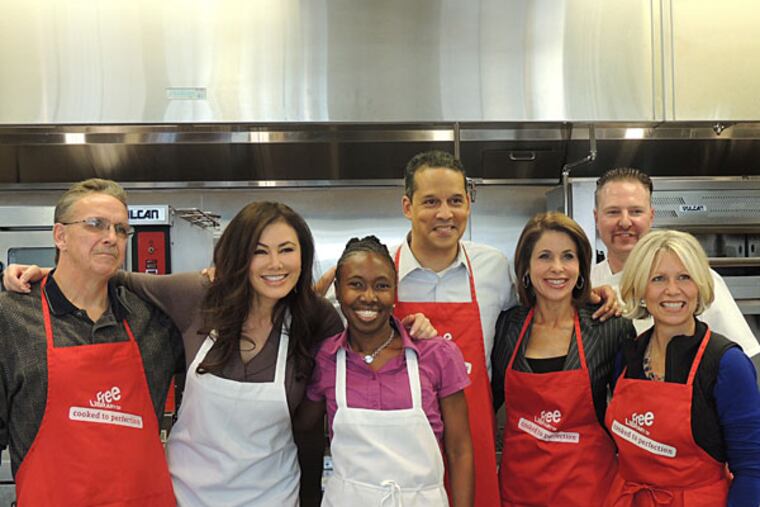 Three local TV personalities cooked for a cancer benefit with three cancer survivors. Here: Andrew Slachta, Fox 29's Lucy Noland, Rhonda Ulmuer, Fox 29 Iain Page, CBS3's Kathy Orr, Chef Steve Irlenborn and Laing Meyer.