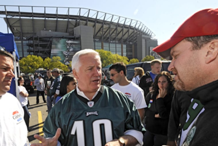 Tom Corbett, the Republican candidate for governor, mingles with fans before an Eagles game outside Lincoln Financial Field. (Clem Murray / Staff Photographer)