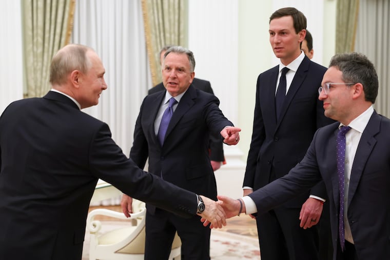 Russian President Vladimir Putin (left) greets President Donald Trump's envoys Steve Witkoff and Jared Kushner, and Josh Gruenbaum (right), the head of the Federal Acquisition Service at the General Services Administration, at the Kremlin on Thursday.