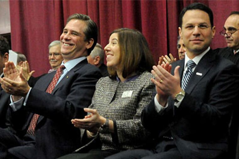 Josh Shapiro (right) and Bruce L. Castor Jr. are sworn in along with Leslie Richards at Montgomery County Community College. Shapiro and Richards are Democrats. (April Saul / Staff Photographer)