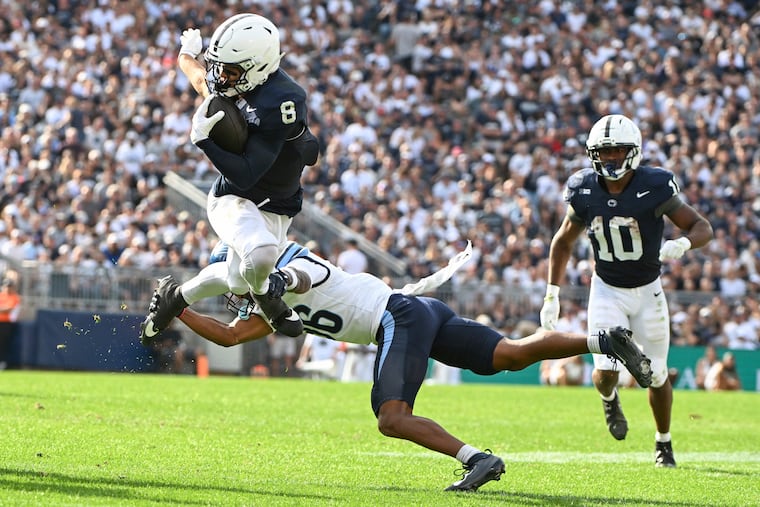 Penn State wide receiver Trebor Pena hurdles Villanova cornerback Damill Bostic Jr. on Saturday.