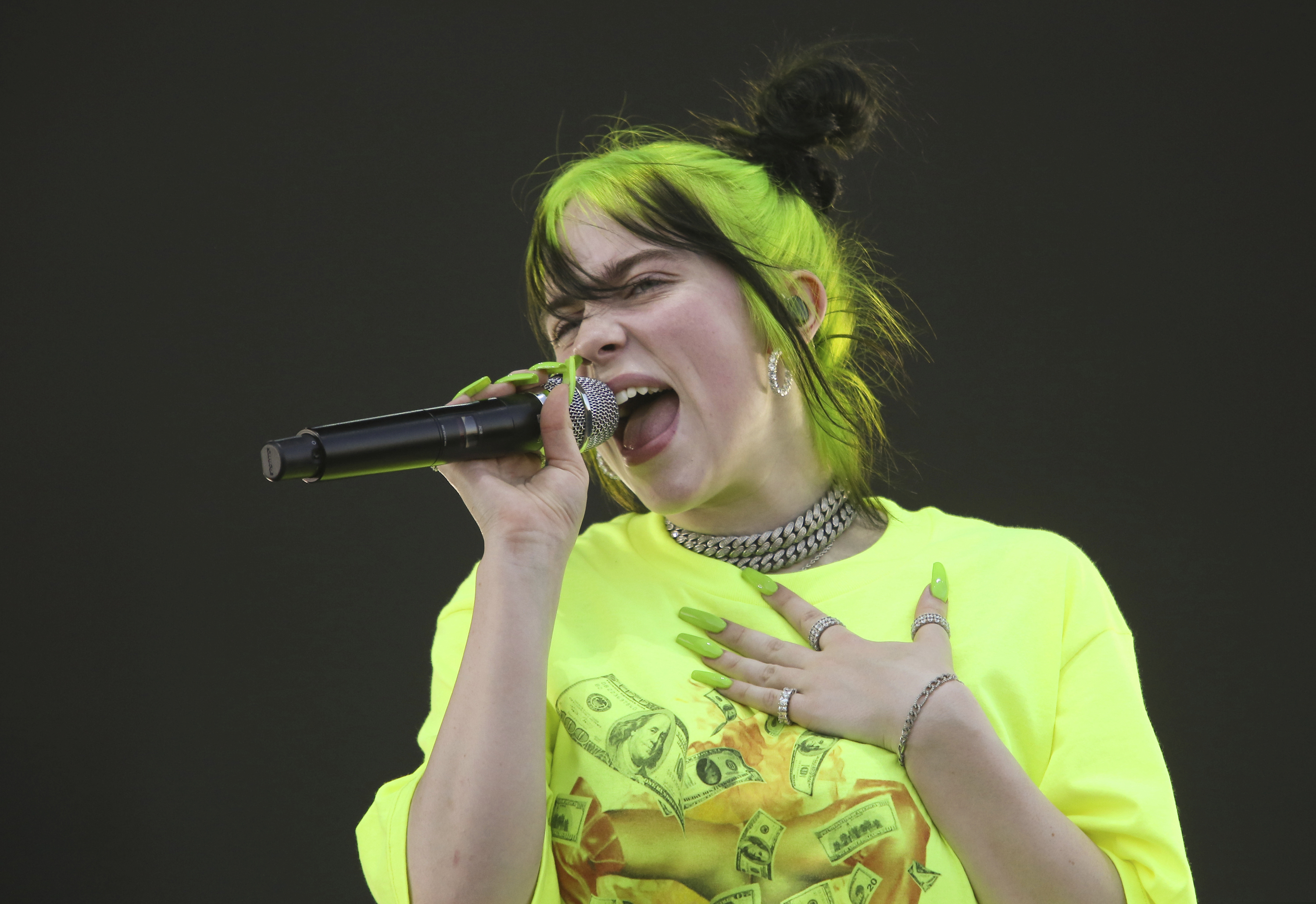 FILE - In this Oct. 5, 2019 photo, Billie Eilish performs during the first weekend of the Austin City Limits Music Festival in Zilker Park in Austin, Texas. Eilish will be the first recipient of the Apple Music Award for global artist of the year, one of three honors for the pop singer. Apple announced Monday that Eilish’s “When We All Fall Asleep, Where Do We Go?” has been named album of the year. Eilish and her brother Finneas will also receive songwriter of the year honors. (Photo by Jack Plunkett/Invision/AP, File)