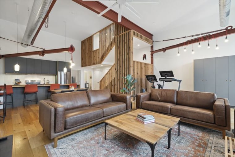 The open floor plan integrates the living, dining, and kitchen areas.