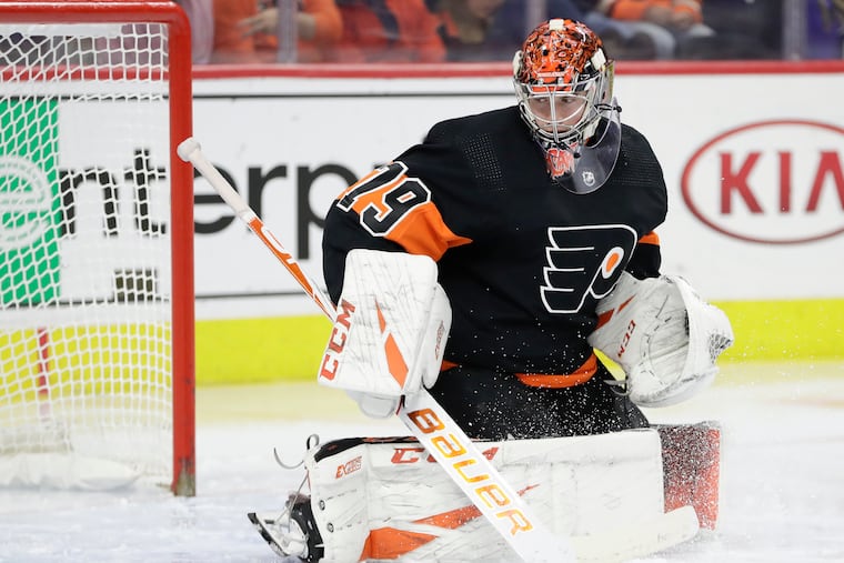 Flyers goaltender Carter Hart warms up before a Dec. 23 game against the New York Rangers. He'll be making his playoff debut when the season returns.