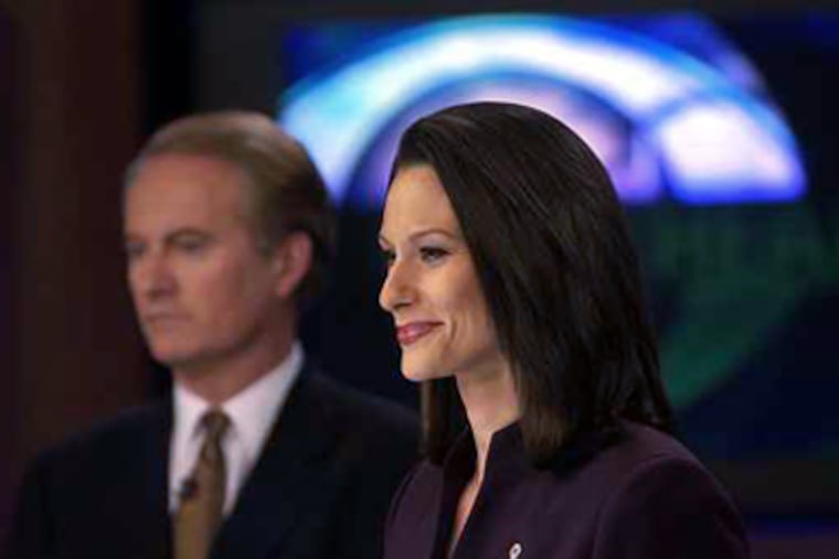 Alycia Lane with Larry Mendte when they were co-anchors. (Inquirer file photo)